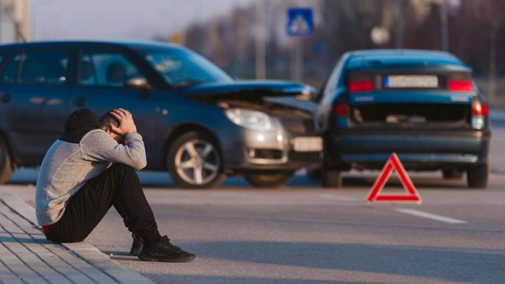 Driver involved in a vehicle accident seeking collision repair services in Phoenix, AZ.