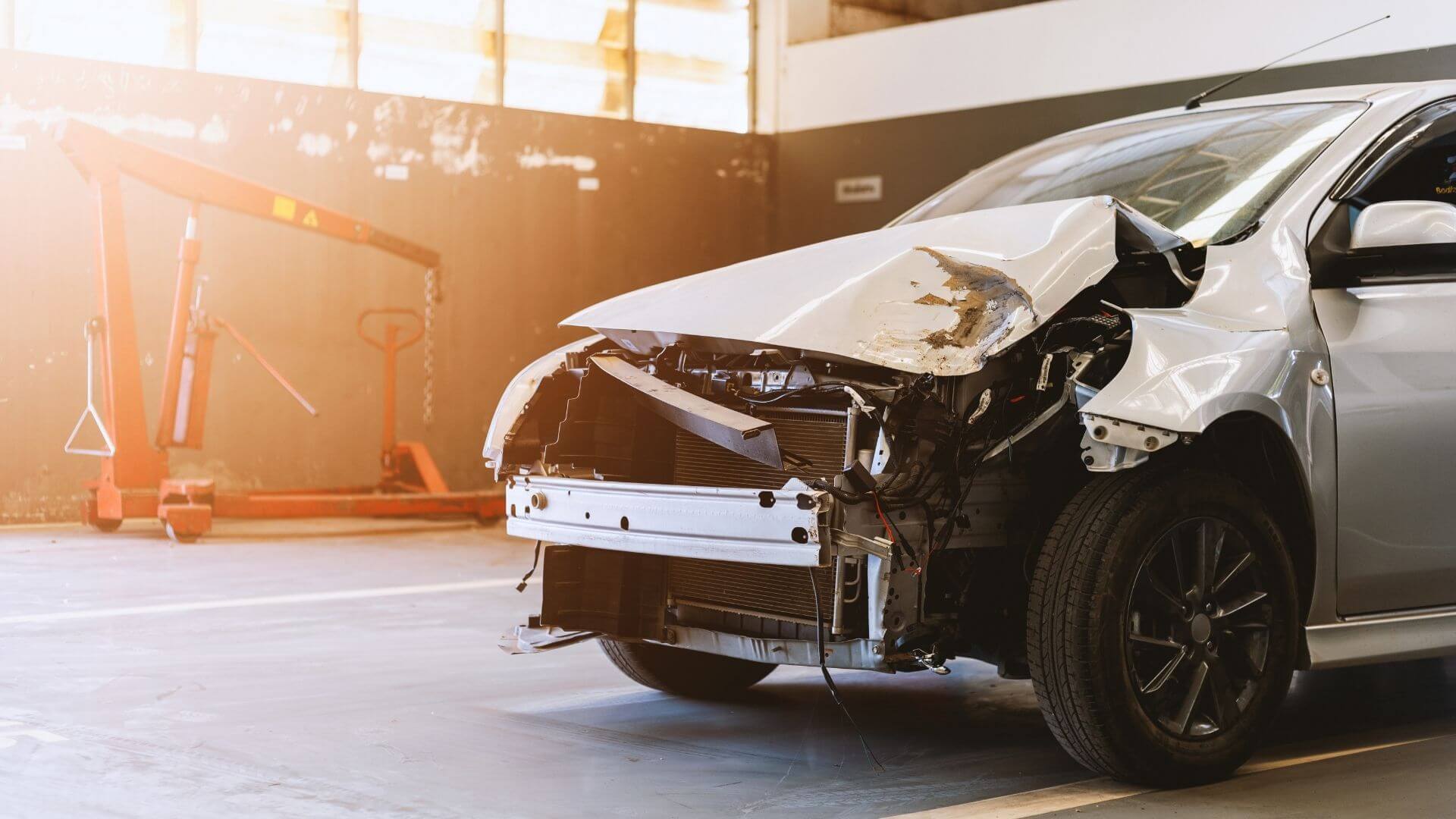 Collision-damaged vehicle awaiting professional auto body repair services in Phoenix, AZ.